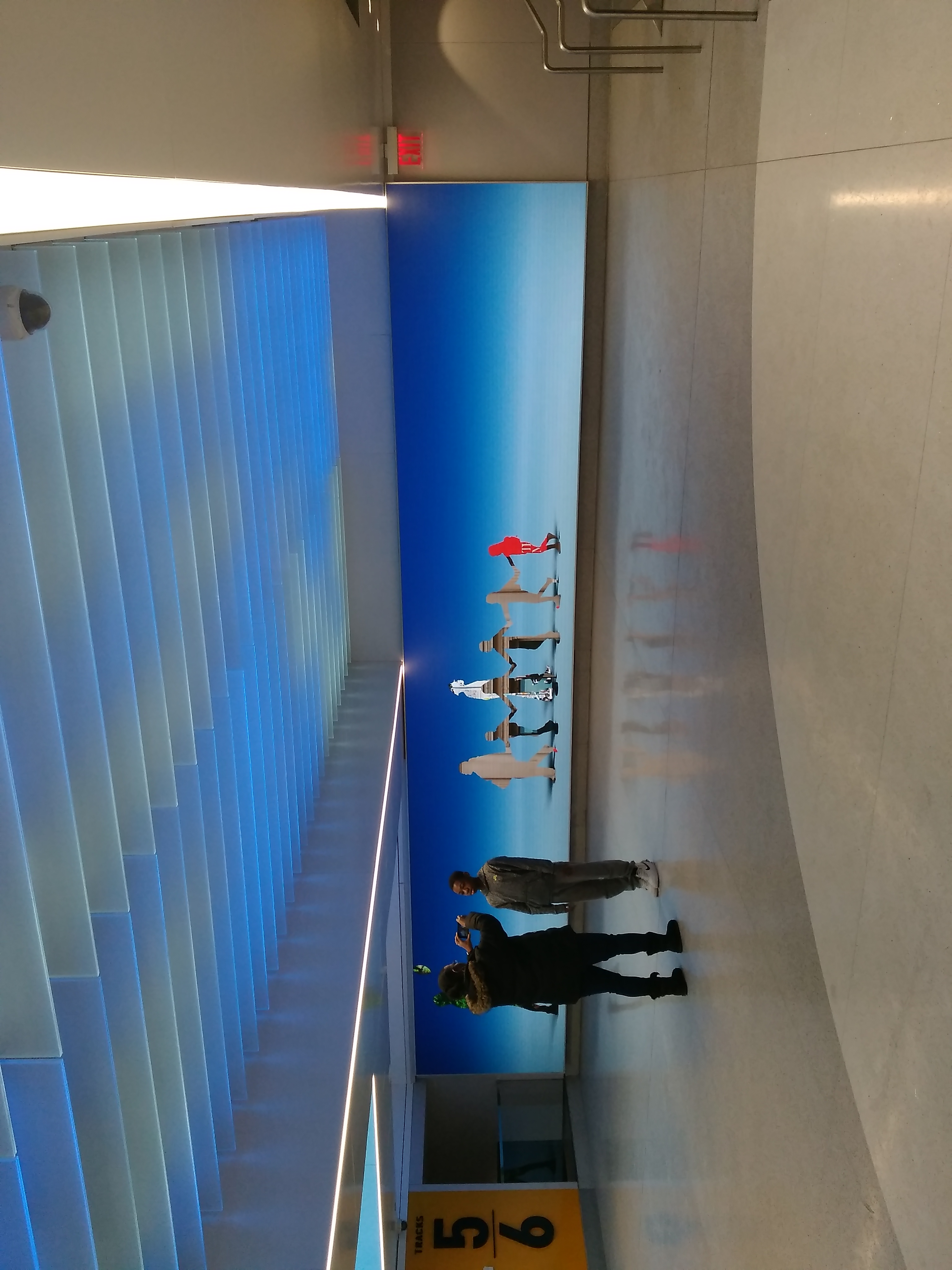 Kim-and-Chris-on-Penn-Station-Concourse-by-Allison-L-Williams-Hill